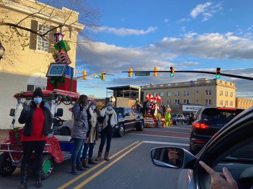 Belmont's "Cruise-Thru Christmas" parade had stationary floats with vehicles driving past.