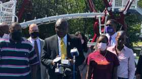Attorney Ben Crump joined by Micah “Dew” Tennant’s parents Samuel Dunmore (left) and Angela Tennant along with Micah’s aunt Monica Tennant (far right) as he announces a lawsuit against the Pleasantville Board of Education and NJSIAA.