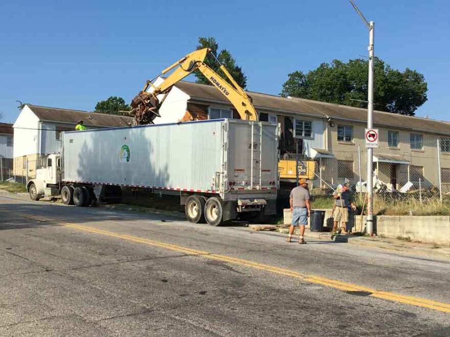 An L & J Waste Recycling crew on site in Baltimore. The firm is training and employing previously incarcerated youth as part of a collaborative program with ROCA, a non-profit violence interruption organization. (photo courtesy LJWinc.)