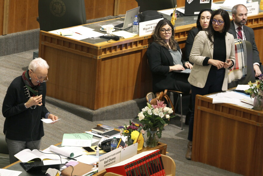 Democratic state Rep. Gail Chasey, left, of Albuquerque, leads an hourslong debate about an abortion bill on the House floor on Friday, March 17, 2023, in Santa Fe, N.M. The House secured final passage of the bill that aims to protect abortion providers and patients from out-of-state interference, prosecution or extradition attempts on a 38-30 vote of the House. (AP Photo/Morgan Lee)