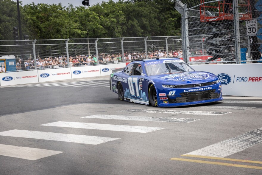 A car circles the track during the Xfinity Loop Series