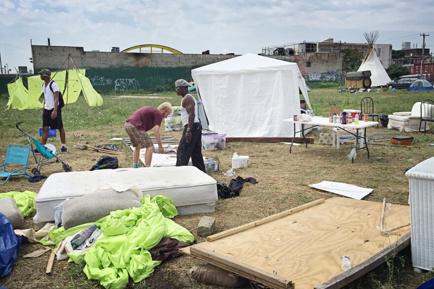 Volunteers dismantle the "Clintonville" campsite on the last day of the Democratic National Convention.