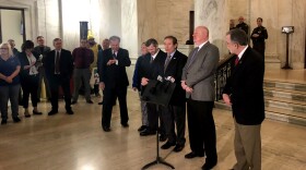 The leaders of West Virginia teacher and service personnel unions announce a statewide strike Monday, Feb. 18, 2019 outside the Senate chambers at the Capitol.
