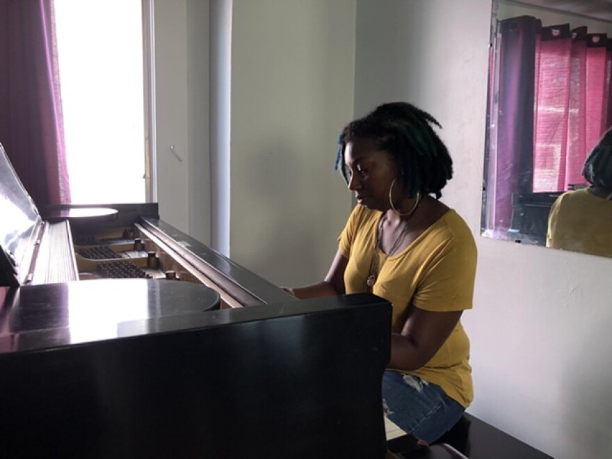 Avis Reese plays the grand piano gifted to her by a stranger. A friend will store the piano until Reese decides where she'll make her new home.
