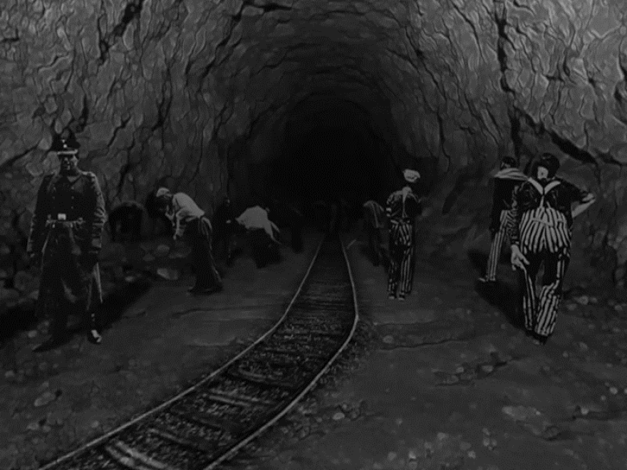 A still image from "Don't Forget Me," illustrating the mining tunnels at the Ebensee concentration camp in Austria, where George Brent and other inmates were forced to perform slave labor.