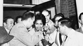 Student Charlayne Hunter, 18, the first Black girl to attend the University of Georgia, smiles as she is interviewed in Athens, Georgia, on Jan. 11, 1961 following her first class in Meigs Hall. The previously White university was ordered to integrated by federal courts. (AP Photo/Horace Cort)