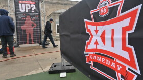  Workers with Loud Production Group set up displays at Barney Allis Plaza on Wednesday afternoon preparing for the Big 12 womens' basketball tournament that will tip off across the street at Municipal Auditorium on Thursday, March. 9.
