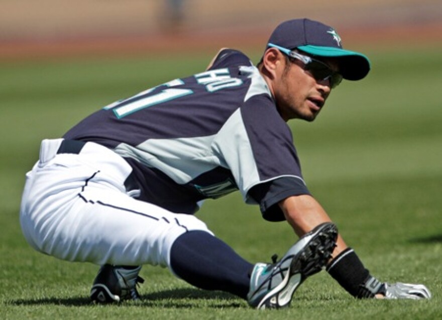 Mariners right fielder Ichiro Suzuki stretches before a spring training game in Arizona last month. Art Thiel says Ichiro is the only player to be starting in the same position he played last year, as the Mariners shuffle things around.