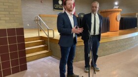 Indiana Democratic Party Chair Mike Schmuhl (left) and 2nd Congressional District candidate Paul Steury speak after the Democratic caucus to fill a special election ballot vacancy on Tuesday, Aug. 23.