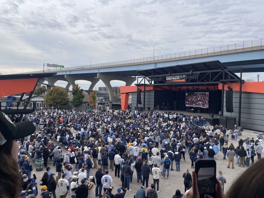 Brewers fans prepare for a victory rally at the Summerfest grounds.