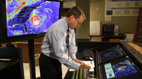 FILE - In this Sept. 2, 2010, file photo, Chief hurricane forecaster James Franklin prepares for a live update on Hurricane Earl at the National Hurricane Center in Miami. Franklin, a retiring chief of the hurricane specialist unit at the National Hurricane Center in Miami says further cuts to tropical weather research threaten to undermine recent improvements in hurricane intensity forecasts. (AP Photo/Lynne Sladky, File)