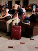 Do you have some free time this Labor Day weekend? Spend it reading about a fascinating frame-up — or pondering the long hours we work. Here, travelers wait for trains at Union Station in Washington, D.C., on Friday, the start of the holiday weekend.