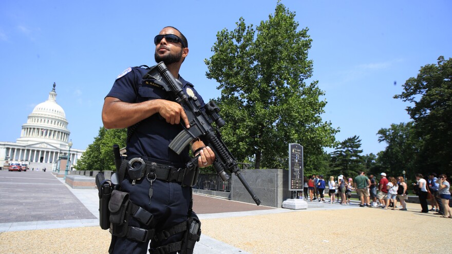 A Capitol Police officer stands guard on Capitol Hill in Washington, D.C., on Wednesday after House Majority Whip Steve Scalise, R-La., was shot during a congressional baseball practice in Alexandria, Va.
