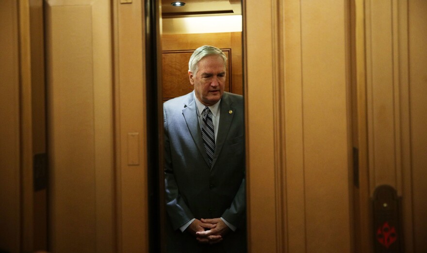 Appointed Sen. Luther Strange, R-Ala., takes the elevator as he arrives at the Capitol for a vote.