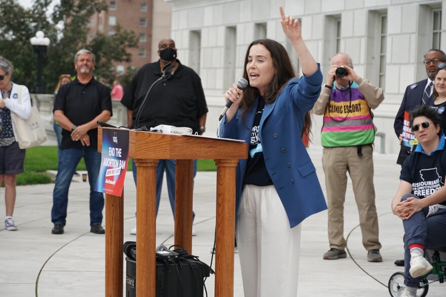 Tori Schafer, with the ACLU of Missouri, speaks to supporters as abortion advocates turn in thousands of signatures seeking to enshrine abortion rights within the Missouri constitution