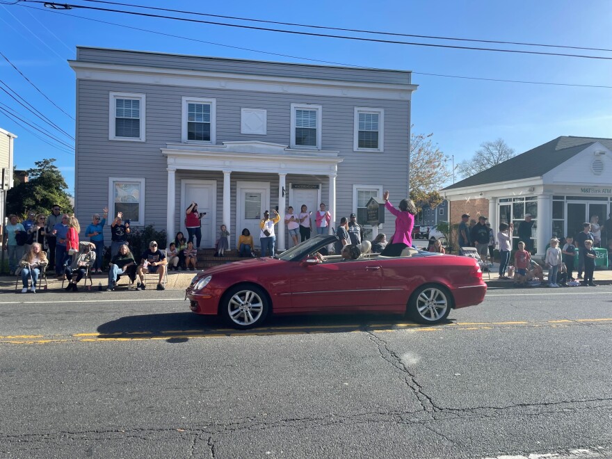 US Congresswoman Lisa Blunt Rochester rides alone in a convertible during Georgetown's Return Day parade on Thursday.