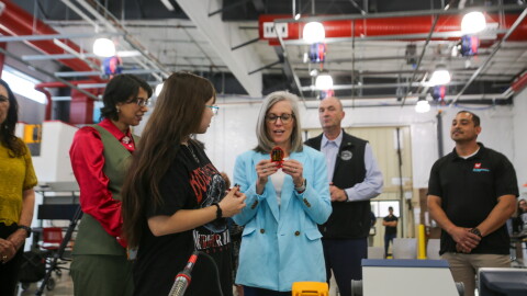 A student demonstrates some of the material she and her peers have been learning at the AWC Future48 Workforce Accelerator with Arizona Gov. Katie Hobbs. The accelerator is one of seven in the state.