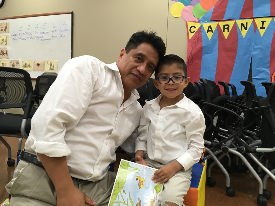 Hector Peña and his 3-year-old son recently attended a "Breakfast with Books and Dad" literacy event at an early childhood center in Tulsa, Okla.