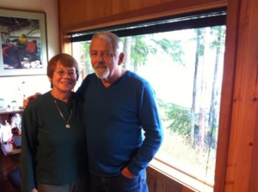 Tina and Lee Krause stand near the window where Windex made his surprise entrance in 1995. Lee was sitting with his back to the window, less than five feet away, when the eagle came crashing through. (KCAW photo by Ed Ronco)