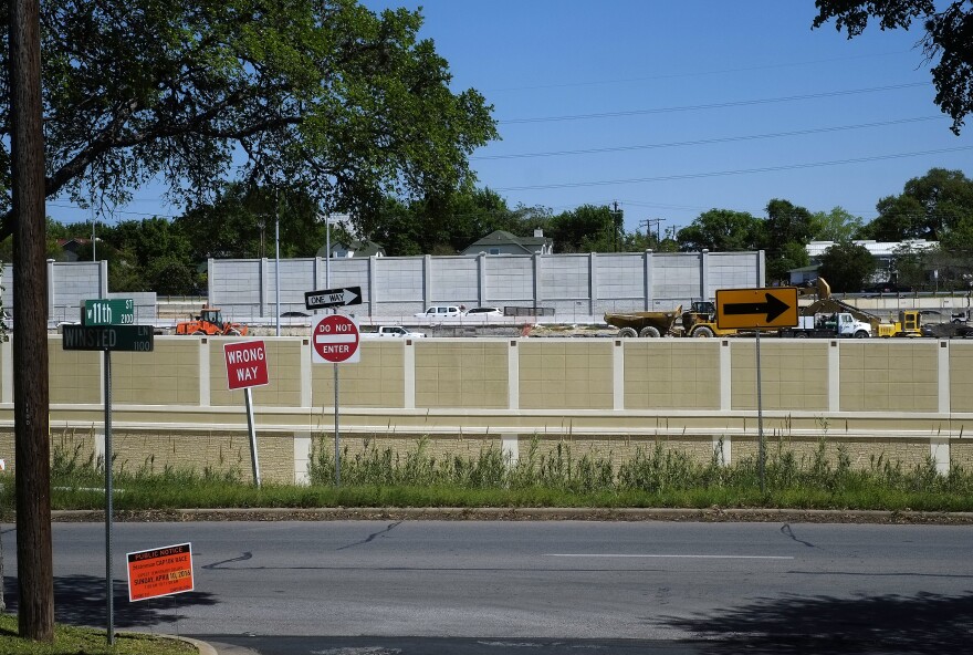 A noise wall on MoPac. You can see the traffic over the wall, suggesting the wall is letting a lot of sound through.