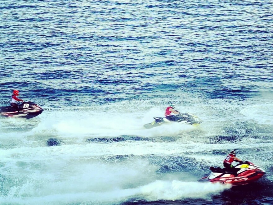 AquaX jet ski racing in front of the St. Pete Pier.