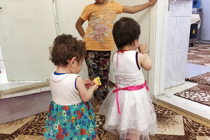 The children at the orphanage were born while their mothers were enslaved by ISIS. A few Yazidi mothers come to the orphanage to personally hand over their babies. But others are separated from their children just before they cross back into Iraq, and they don't know what happens to them.