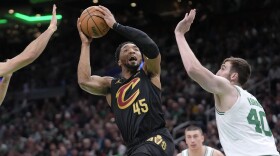 Cleveland Cavaliers guard Donovan Mitchell (45) shoots as Boston Celtics center Luke Kornet (40) defends during the second half of Game 2 of an NBA basketball second-round playoff series Thursday, May 9, 2024, in Boston. (AP Photo/Steven Senne)