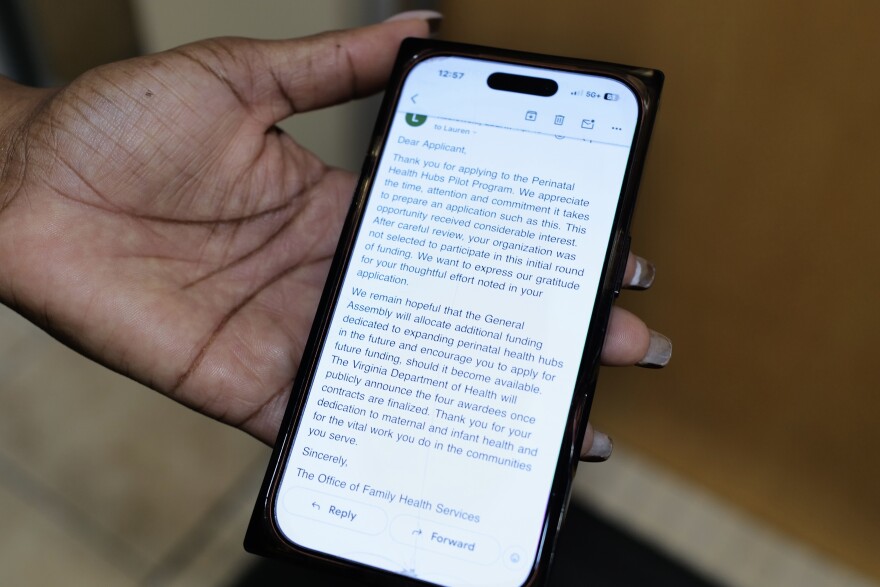 Heather Wilson, founder of Kennedy’s Angel Gowns, shows the rejection email she received from the Virginia Department of Health for the state’s Perinatal Health Hubs Pilot Program.