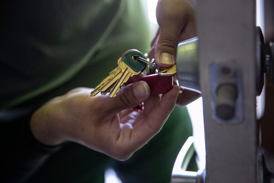 An apartment maintenance man changes the lock of an apartment after constables posted an eviction order in Phoenix, Arizona. Thousands of court-ordered evictions continue nationwide despite a Centers for Disease Control moratorium for renters impacted by the coronavirus pandemic. Although state and county officials say they have tried to educate the public on the protections, many renters remain unaware and fail to complete the necessary forms to remain in their homes. With millions of Americans still unemployed due to the pandemic, federal rental assistance proposals remain gridlocked in Congress. 