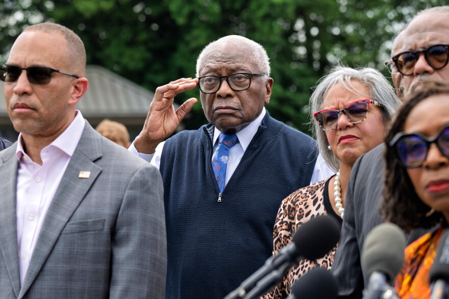 FILE - Rep. Jim Clyburn, D-S.C., center, joined by House Minority Leader Hakeem Jeffries, D-N.Y., left, stands with members of the Congressional Black Caucus during an event outside the Capitol in Washington, May 19, 2026. (AP Photo/J. Scott Applewhite, File)