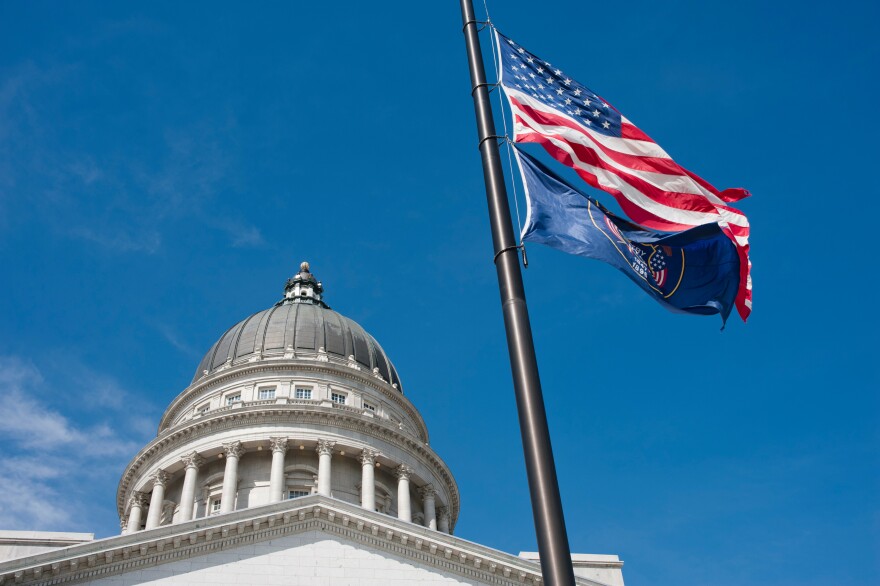 [FILE] An American flag and State of Utah flag fly at half mast near the Utah State Capitol. Gov. Spencer Cox ordered flags to be lowered at state facilities Monday in honor of the 9/11 tragedy.