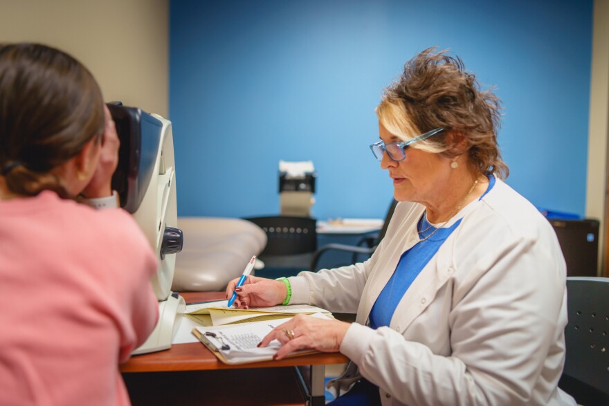 Valley View School District school nurse, Mary Ann Chindemi, works with a student in her office.