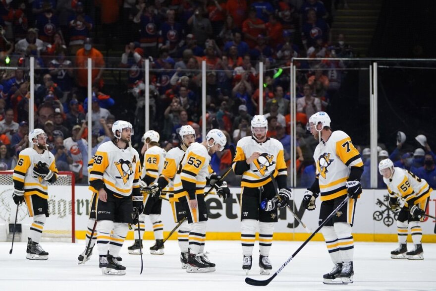 The Pittsburgh Penguins react after Game 6 of an NHL hockey Stanley Cup first-round playoff series against the New York Islanders, Wednesday, May 26, 2021, in Uniondale, N.Y. The Islanders won 5-3. (AP Photo/Frank Franklin II)