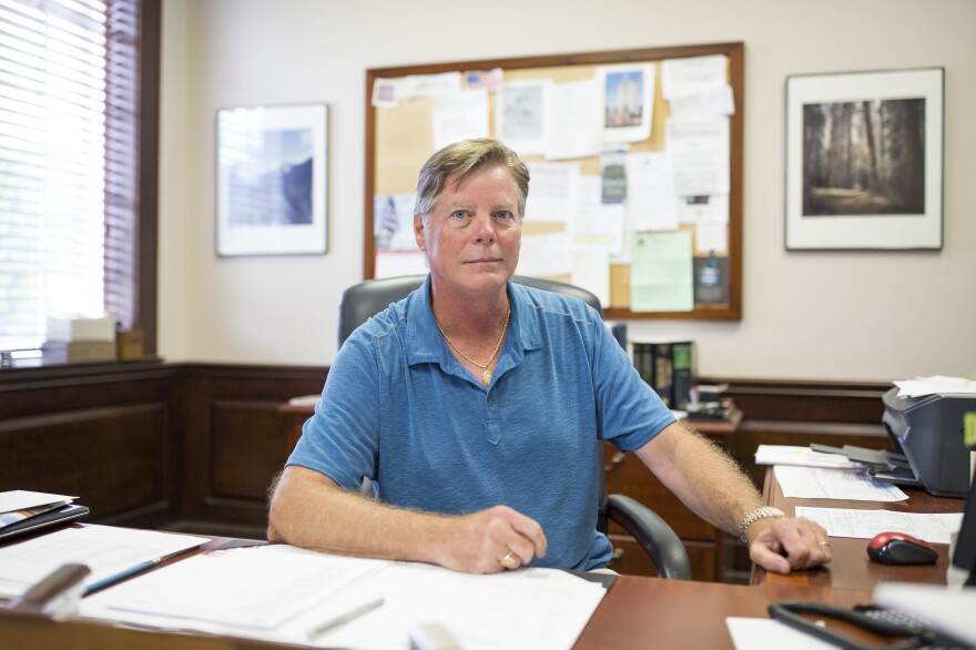 Michael Stevens, senior executive vice president of Vaughan Furniture Company, sits at his desk in Galax, Va. Following the decline of the furniture production industry in Galax, the Vaughan Furniture Company was forced to largely shut down. Now Stevens oversees the leasing of their facilities and office spaces to other companies as they try to sell their large properties in town.