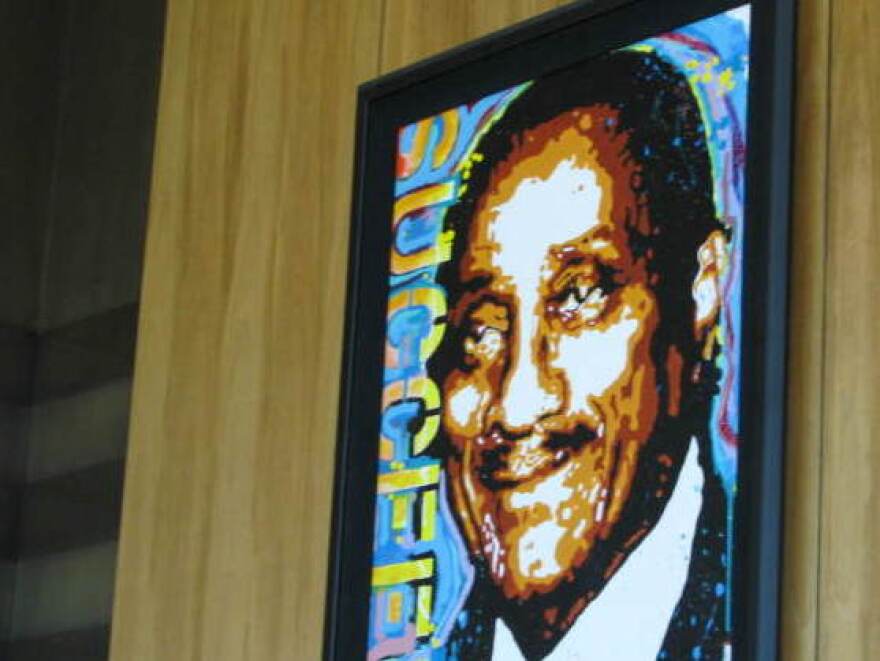 A portrait of Johnson Publishing Co. founder John H. Johnson hangs in the company's lobby, embellished with the word "succeed." <em>Ebony's </em>September issue included an article on how to raise a high achiever.