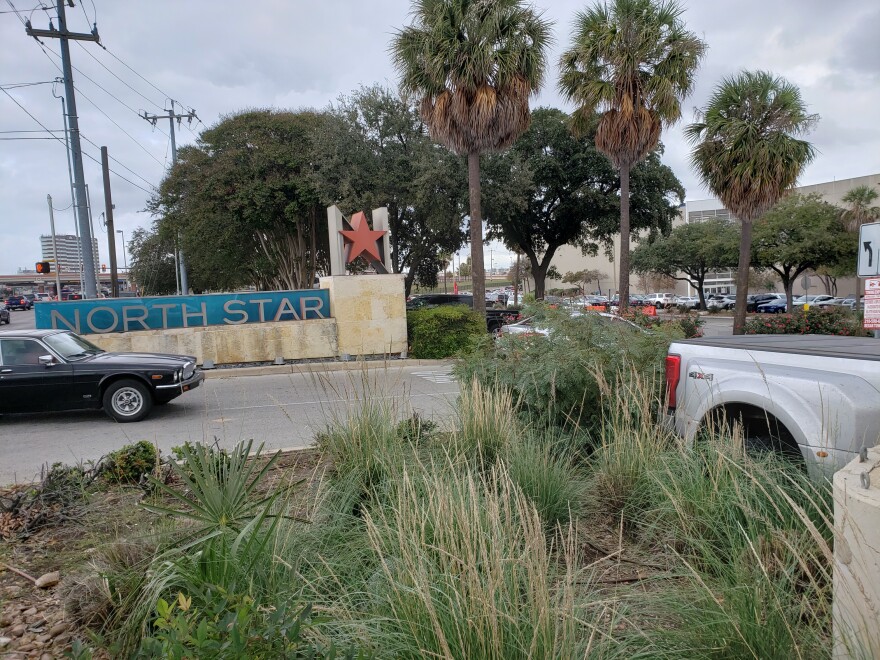 Cars entering an entrance at North Star Mall on Wednesday. A packed parking lot in front of Macy's can been seen in the distance