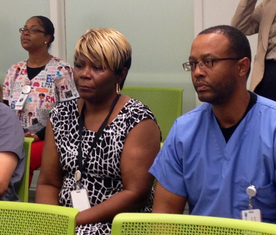 Affinia Healthcare employees listen to a press conference held by Missouri Senator Roy Blunt. Affinia has increased its staff by 16 percent in the past four years with an influx of funding from the Affordable Care Act. 