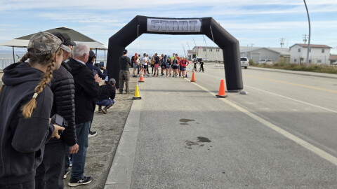 Spectators watch before the start of the Cape Blossom marathon on August 29.