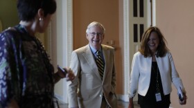 Senate Majority Leader Mitch McConnell (R-Ky.), center, talks with his chief of staff Sharon Soderstrom, right, and communications staff director Antonia Ferrier, left, as they walk to his office on Capitol Hill in Washington, Monday, June 26, 2017. Senate Republicans unveil a revised health care bill in hopes of securing support from wavering GOP lawmakers, including one who calls the drive to whip his party's bill through the Senate this week "a little offensive." (Carolyn Kaster/AP)