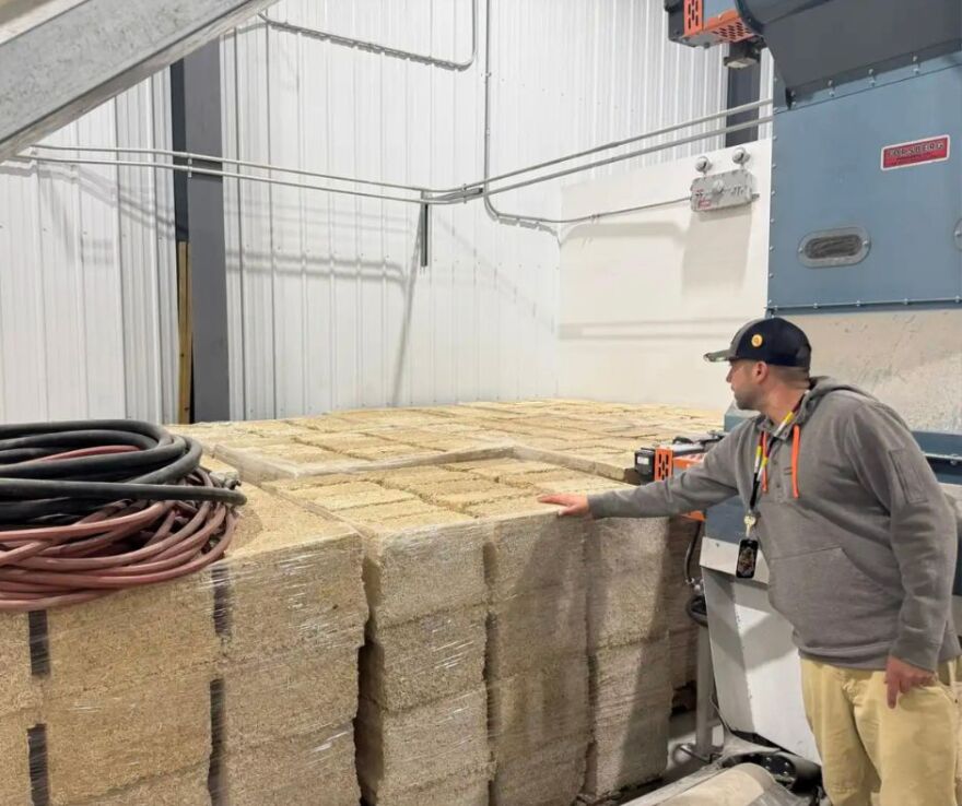 Danny Dejarlais, who runs the Lower Sioux Indian Community’s hempcrete business, points out hempcrete blocks manufactured and stored in its warehouse on the reservation | MPR News