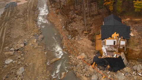 Extensive damage to roads and property in the Chimney Rock Village area of Rutherford County in the aftermath of Tropical Storm Helene are seen in this aerial image on Nov. 10, 2024.