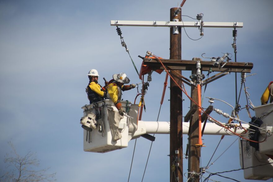 Workers repair power lines in Albuquerque on Feb. 25, 2026. (Danielle Prokop/Source NM)