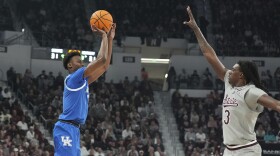 Kentucky guard Jaxson Robinson, left, prepares to shoot a basket past Mississippi State forward KeShawn Murphy (3) during the first half of an NCAA college basketball game, Saturday, Jan. 11, 2025, in Starkville, Miss. (AP Photo/Rogelio V. Solis)