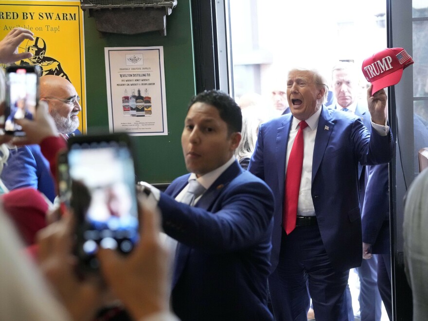 Former President Donald Trump arrives to speak at a Commit to Caucus rally Dec. 2 in Ankeny, Iowa.