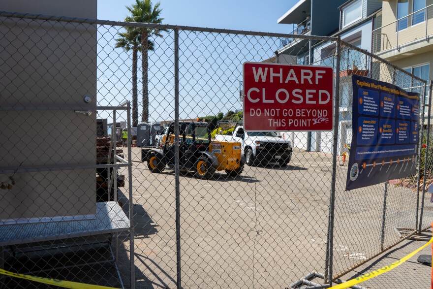 Construction workers readying equipment on Sept. 19, 2023, ahead of a major effort to renovate the Capitola Wharf. The wharf has been closed since storms in early January destroyed a midsection of the wharf.