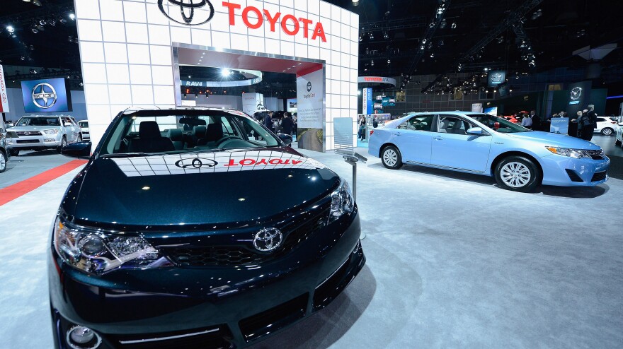 Toyota has agreed to spend more than $1 billion to resolve lawsuits stemming from "unintended acceleration" cases. In November, the company displayed new cars at the Los Angeles Auto show.
