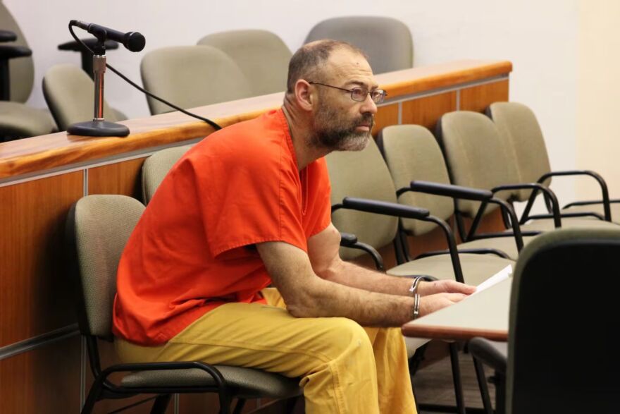 Aaron “Scott” Merritt holds a copy of the indictment from his criminal case while being arraigned on Nov. 4 in Kenai.