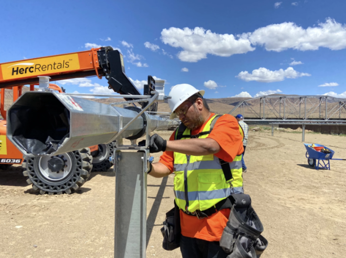 Francisco Valenzuela works on installing a support structure common on large-scale solar farms during training at the Northern Nevada Laborers Training Center in Storey County, Nev., on June 23, 2023.