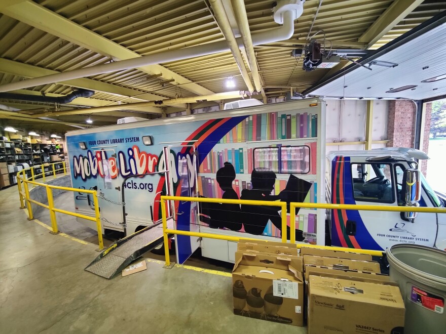 The Four Counties Public Library keeps the bookmobile in a horseshoe shaped garage in Vestal. The walls are curved so the drivers can enter and leave the garage without reversing.