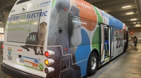 A passenger walks toward a Connect Transit bus in the Uptown Station in Normal.